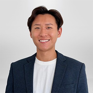man wearing white shirt and blue sport coat