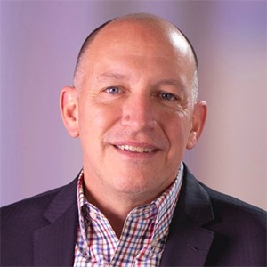 man in plaid shirt and black sport coat