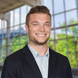 man wearing black sport coat and white dress shirt