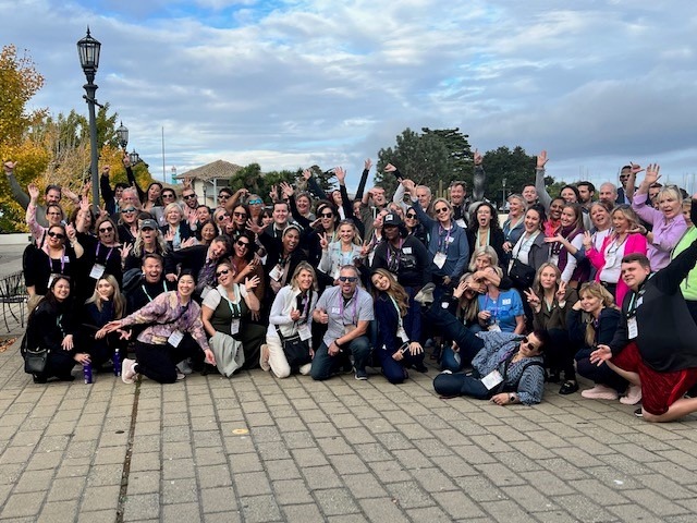 large amount of people posing for picture