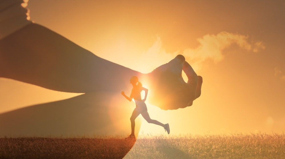 woman meditating and running up hill