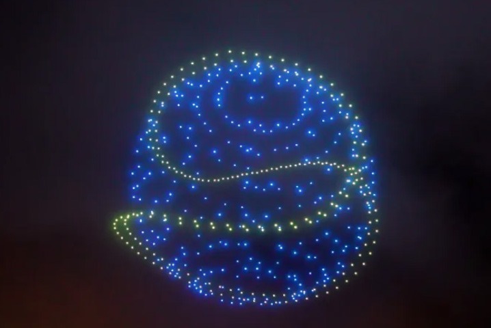drones creating blue sphere
