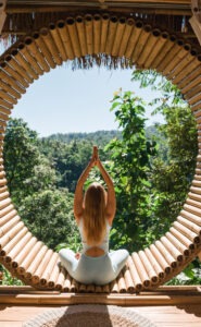woman doing yoga outside