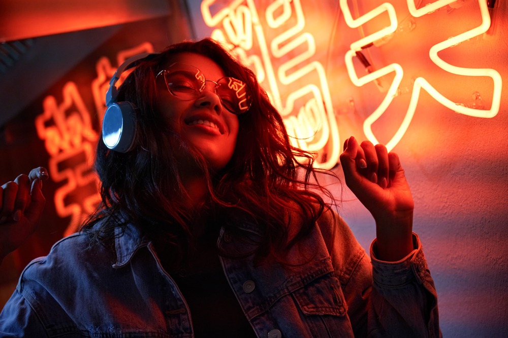 woman wearing headphones and dancing