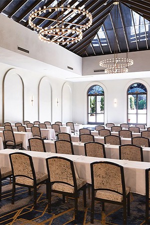 meeting room, brown chairs and white tables