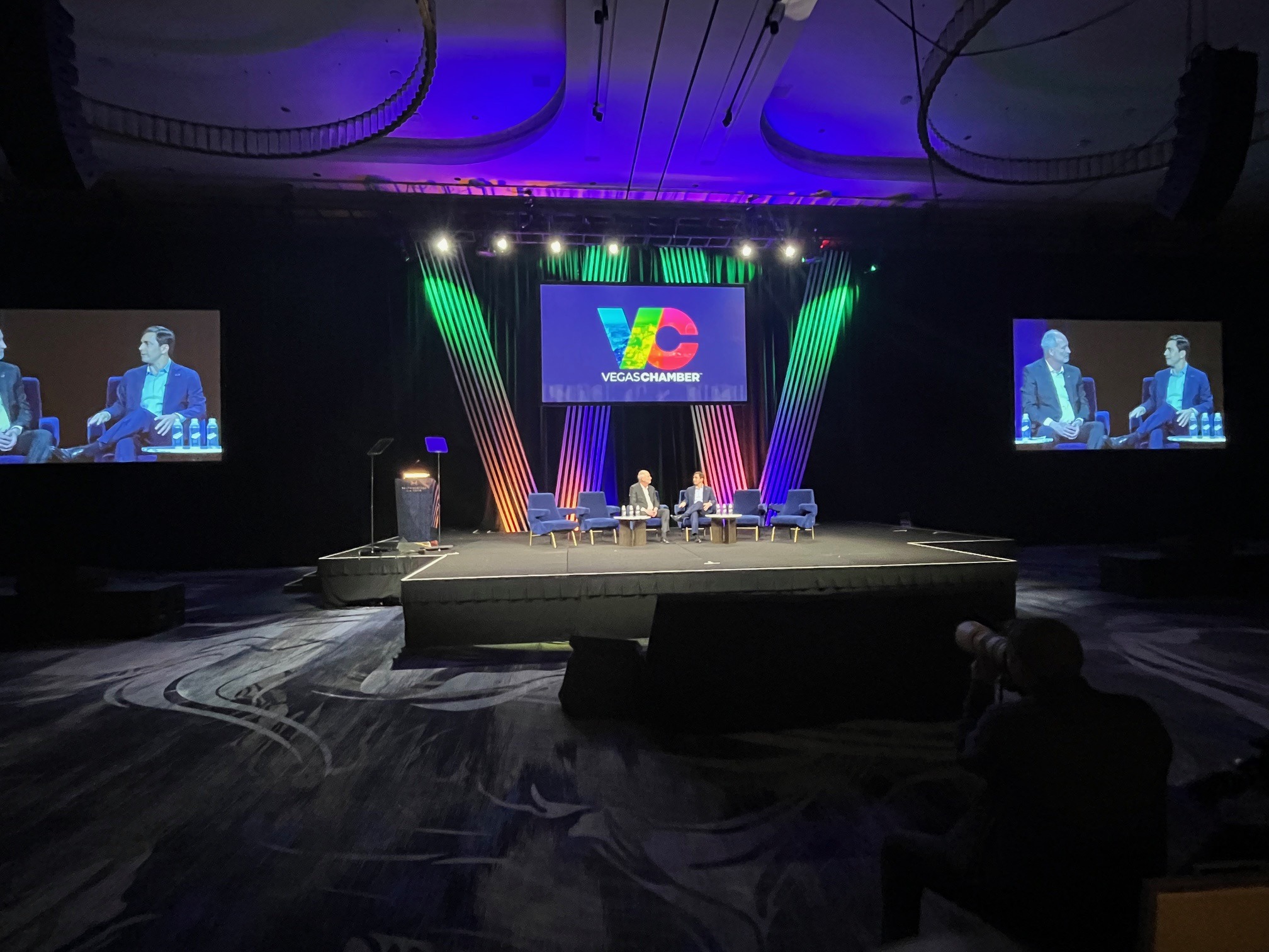 two people on a stage talking