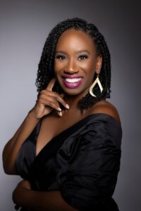 Melva LaJoy Legrand in black dress smiling