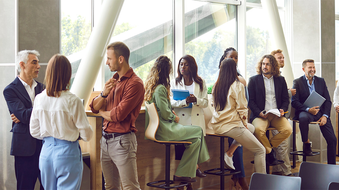 businesspeople talking during networking event