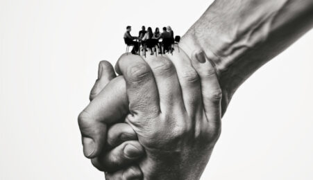 two hands holding each other