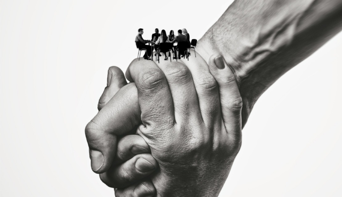 two hands holding each other