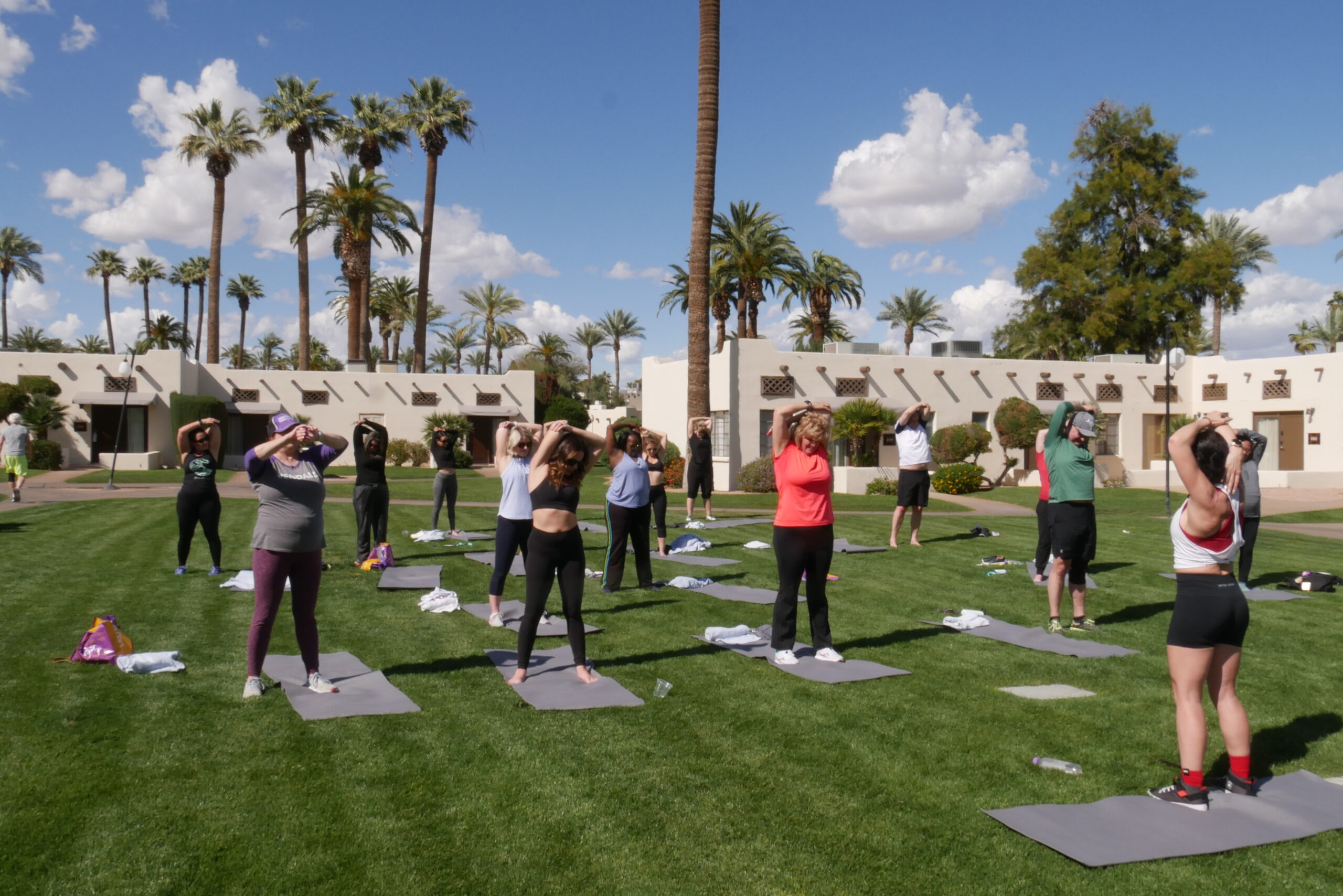 people stretching at outdoor space