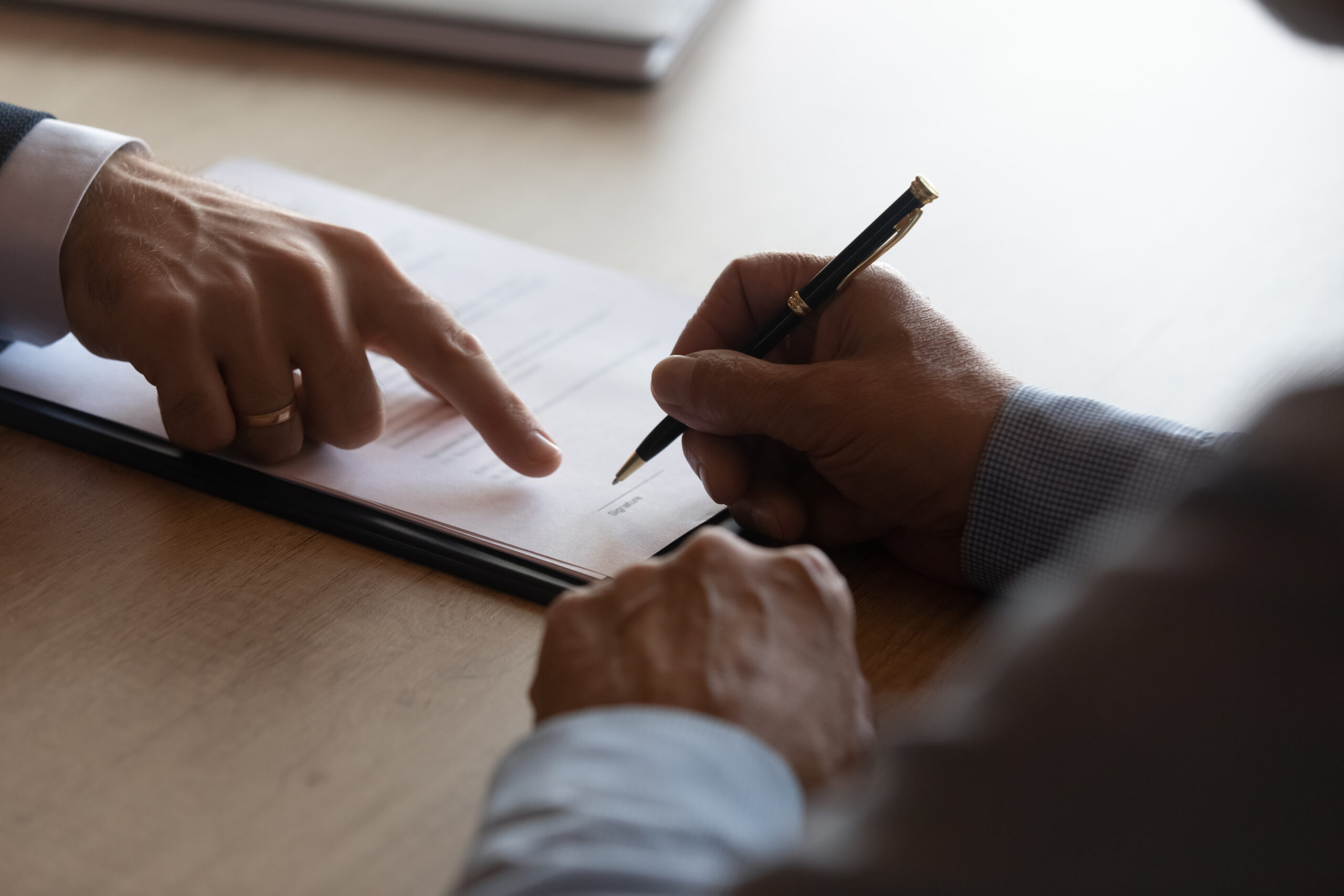 hands writing. signing contract