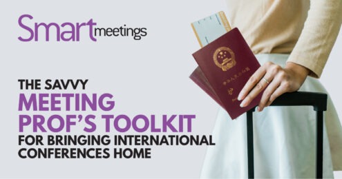 travelers hand resting on suitcase handle with passport in hand