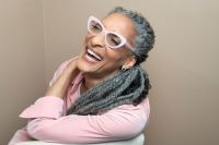 woman in pink long sleeve shirt laughing