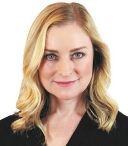 woman in black coat smiling
