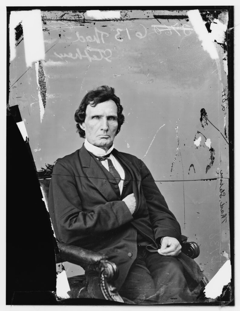 black and white image of man sitting