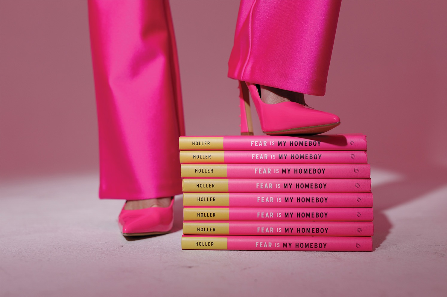 Judi Holler's pink heels sitting on pink books