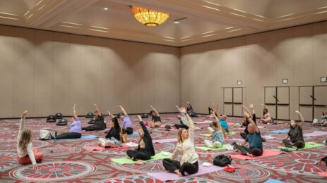 people doing yoga in ballroom