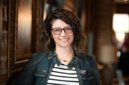 Debbie Garcia wearing denim jacking and black and white striped t shirt profile photo