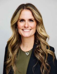 Chiara Tacca wearing black sport coat and green shirt