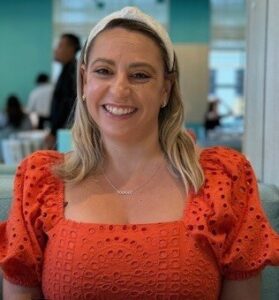 Michela Valente wearing orange shirt