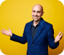 Dan Gangiss in blue sport coat on yellow background profile photo