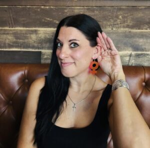 Lisa Kaszubski leaning in in gesture to listen more