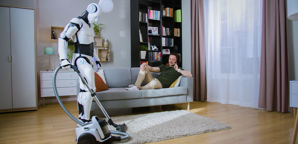 ai robot vacuuming house while man lies on couch