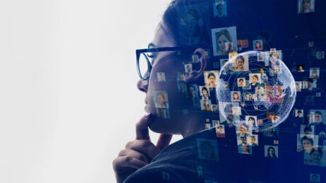 Woman in glasses next to headshots of various people