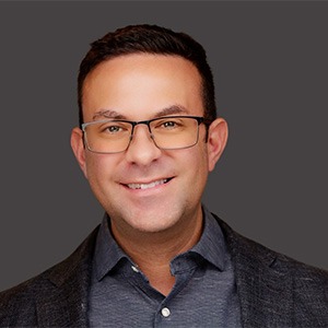 Kevin Siegrist in grey dress shirt and black sport coat