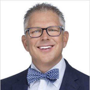 Matthew Pivarnik in blue bowtie, white dress shirt and blue sport coat