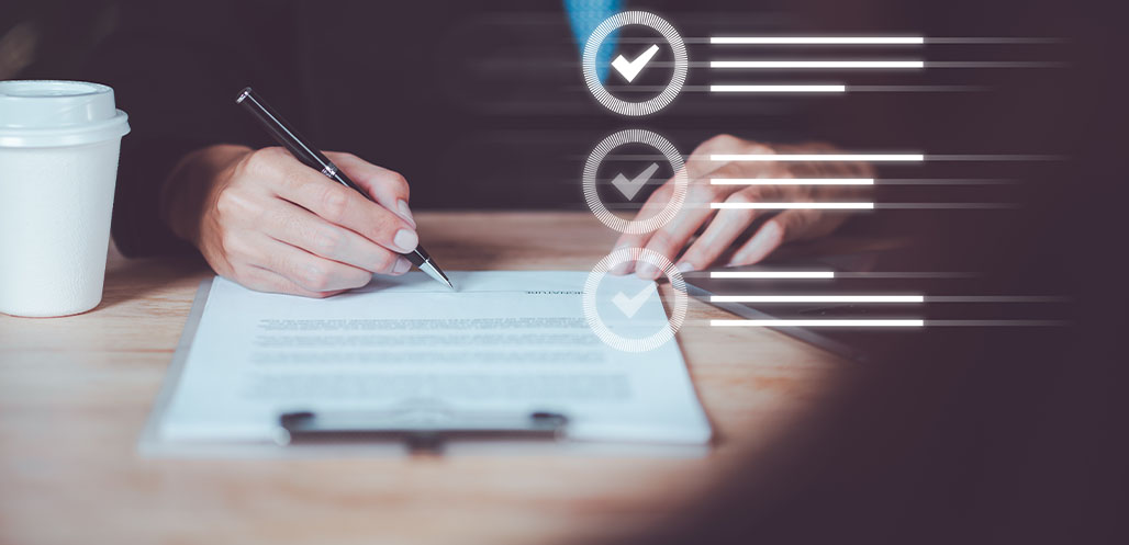 Person writing on contract