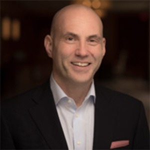 Tim Oldfield in white button up shirt and black sport coat