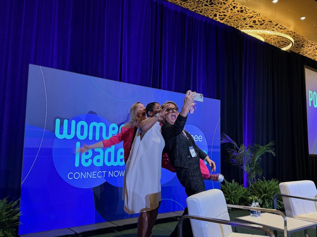 Sherron Washington on stage with Rebecca Heiss at IAEE Womens leadership Forum