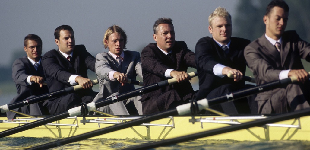 Rowers in business suits