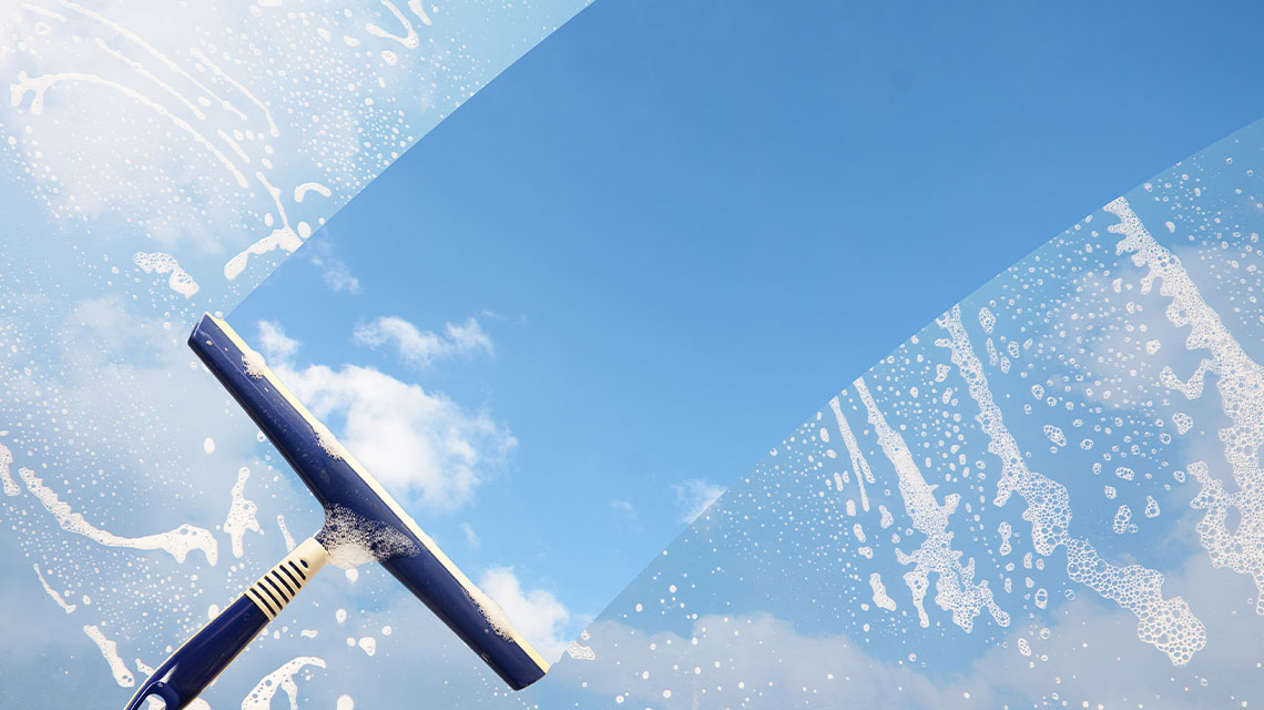 Squeegee wiping soapy windy