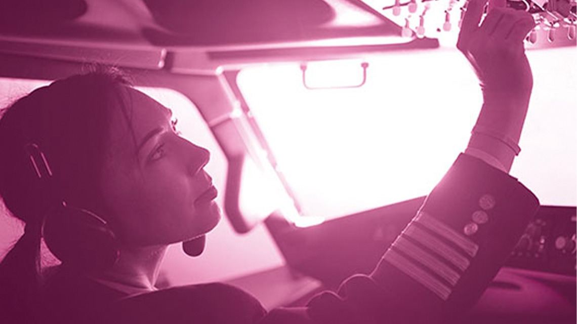 Female pilot in cockpit