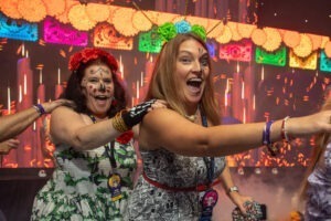 Women dancing in makeup at Marriott's CRN Meet with Momentum Event