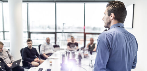 Man talking to group in conference room