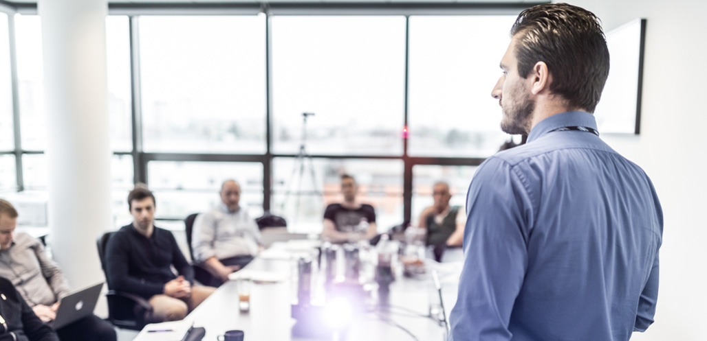 Man talking to group in conference room