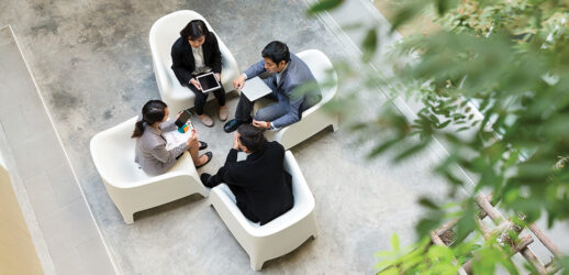 aerial shot of four people meeting