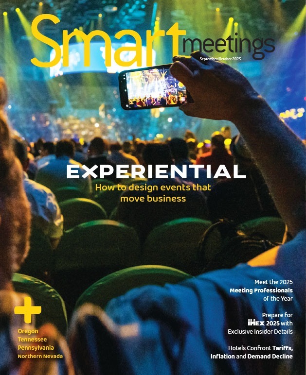 Person taking pictures on phone at event