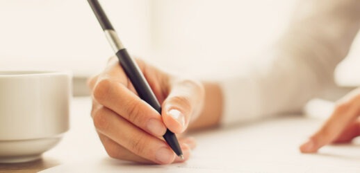 Close up shot of person writing