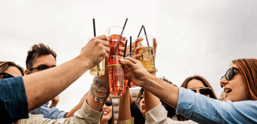 Group of people holding up drinks
