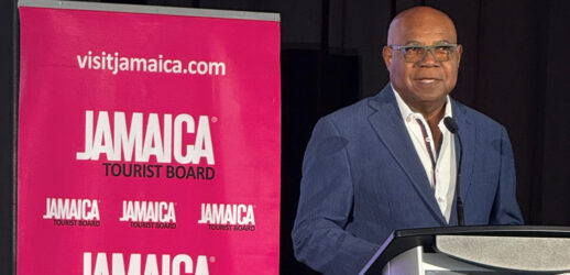 Minister Bartlett speaking on stage