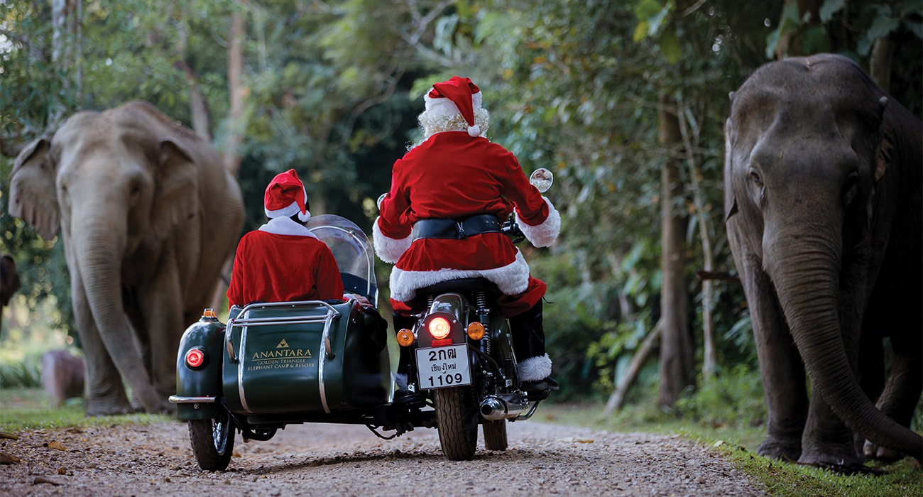 Two santas riding motorcycles