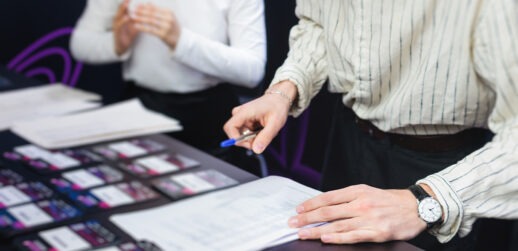 Businesspeople at registration desk