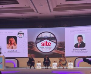 SITE Global stage with three people in chairs