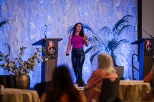 Six-time American Ninja Warrior Angela Gargano on stage at Smart Meetings Wellness Experience