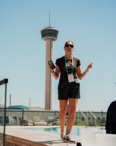 Angela Minardi, founder of Fit City Adventures, leads a breathing exercise o the pool deck at Smart Meetings Wellness Experience